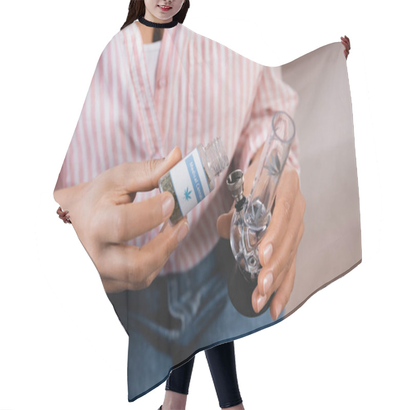 Personality  Cropped View Of African American Woman Holding Glass Bong And Bottle With With Dried Medical Cannabis  Hair Cutting Cape