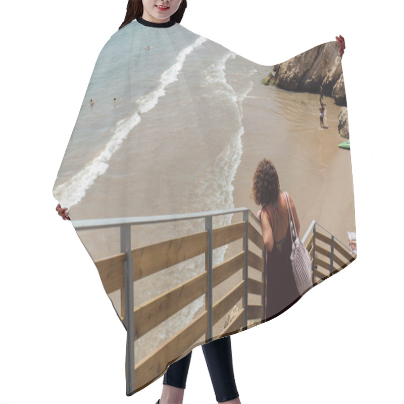 Personality  CATALONIA, SPAIN - APRIL 30, 2020: Selective Focus Of Woman Standing On Staircase With Sandy Beach And Sea At Background  Hair Cutting Cape