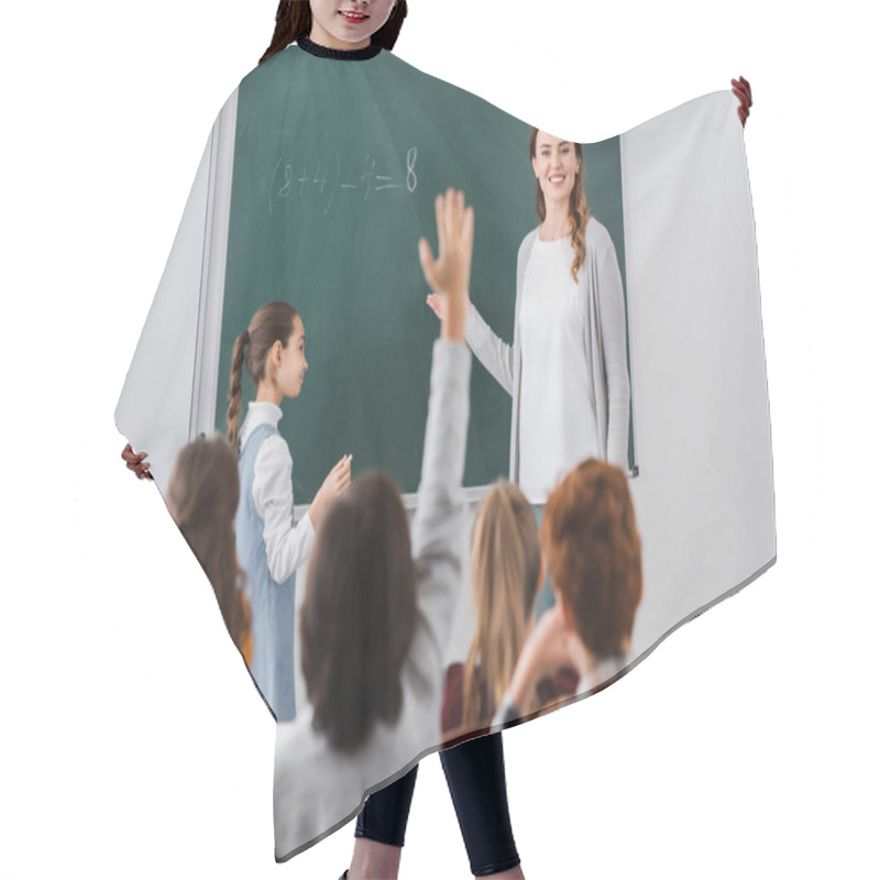 Personality  Smiling Teacher Looking At Schoolboy Raising Hand On Blurred Foreground Hair Cutting Cape