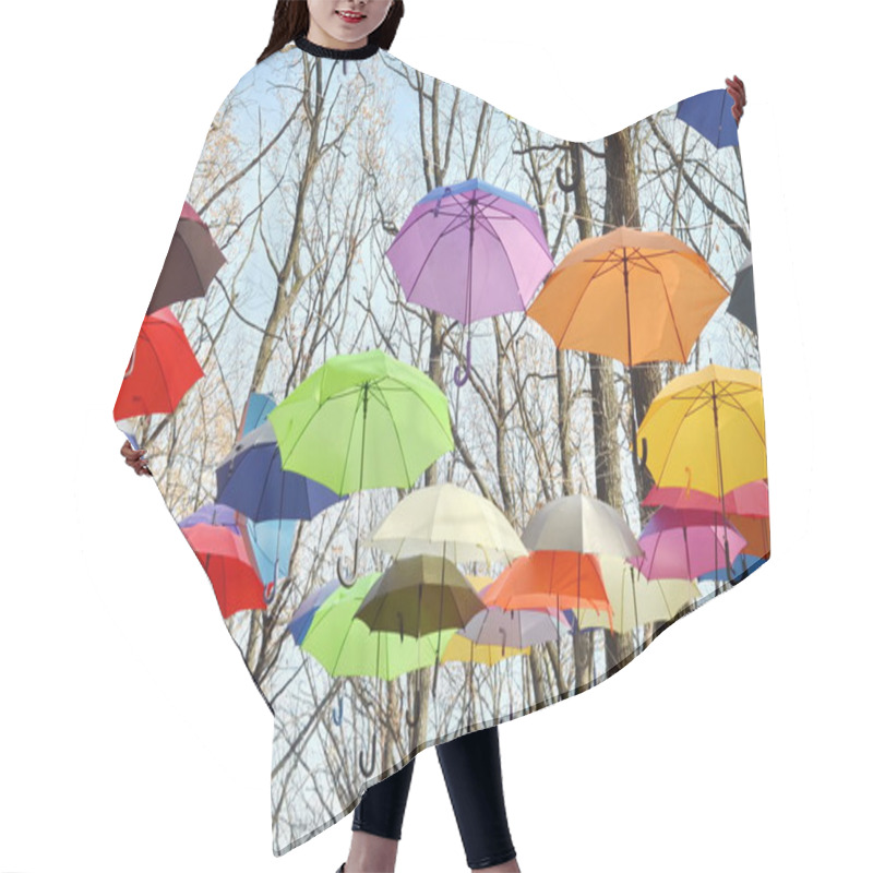 Personality  Many Umbrellas Hang On Trees. Freedom. Hair Cutting Cape