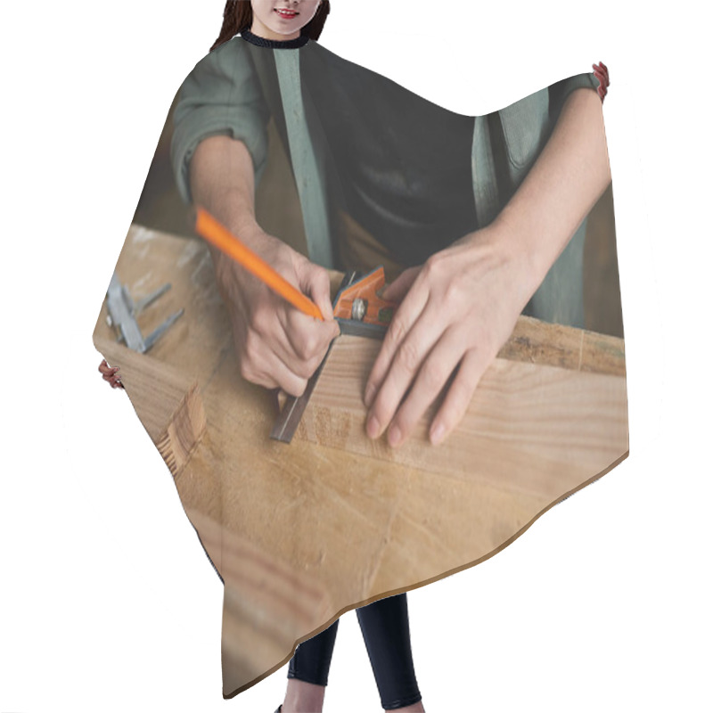 Personality  A Skilled Female Carpenter Focuses On Precision, Measuring And Marking Wood Carefully In Her Workspace. Hair Cutting Cape