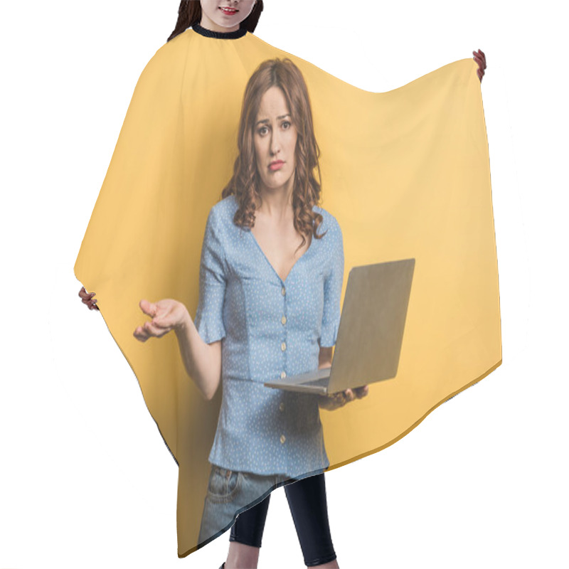 Personality  Confused Girl Showing Shrug Gesture While Holding Laptop On Yellow Background Hair Cutting Cape