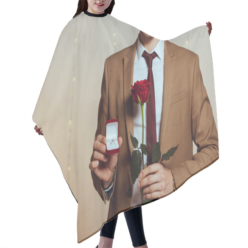 Personality  Partial View Of Elegant Man Holding Box With Wedding Ring And Red Rose While Standing In Restaurant Hair Cutting Cape