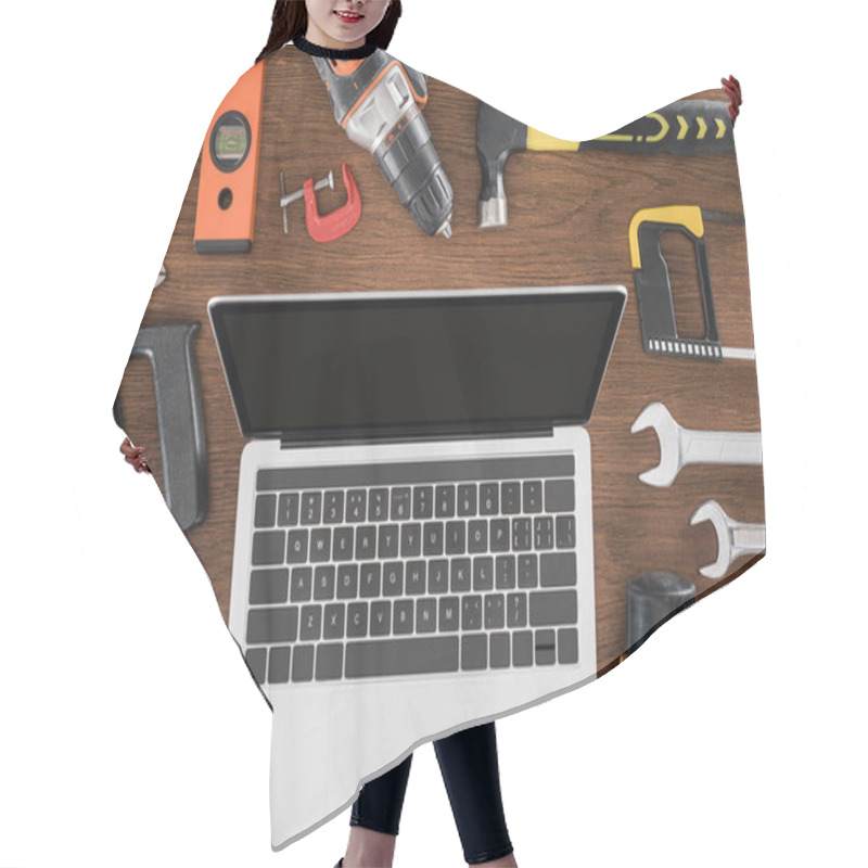 Personality  Top View Of Workplace With Laptop With Blank Screen Surrounded By Various Tools On Wooden Table  Hair Cutting Cape