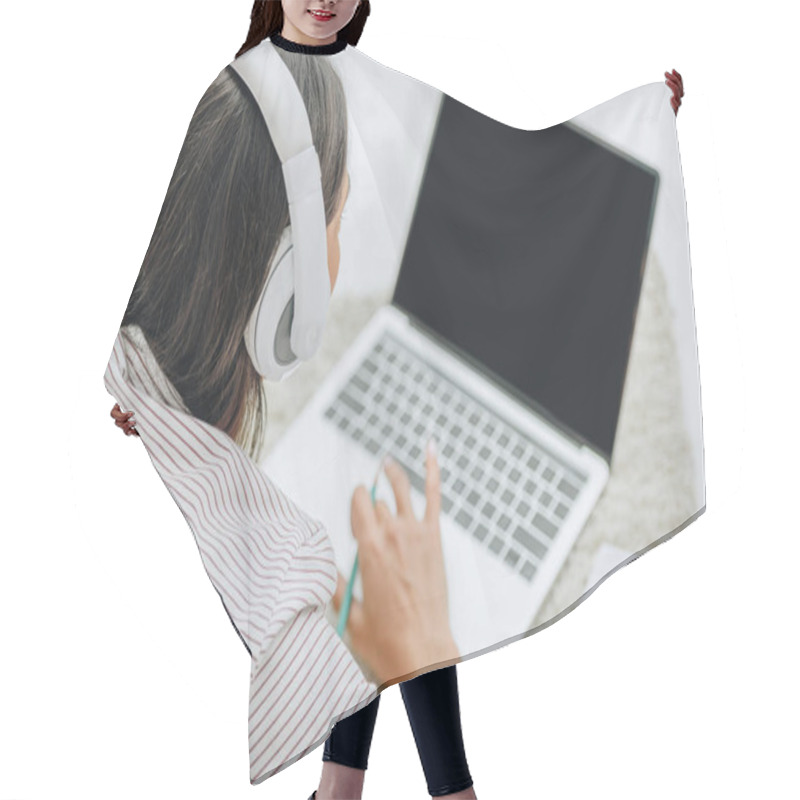 Personality  Back View Of Woman With Headphones Using Laptop And Holding Pencil  Hair Cutting Cape