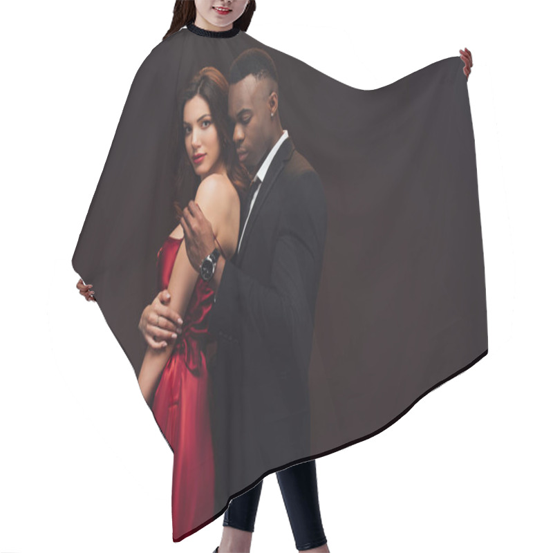 Personality  African American Man Undressing Beautiful Woman In Red Dress Isolated On Black With Copy Space Hair Cutting Cape