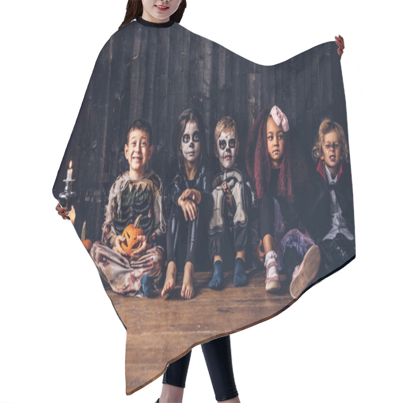 Personality  Halloween Party With Group Children Who Sitting Together On A Wooden Floor In An Old House. Halloween Concept. Hair Cutting Cape