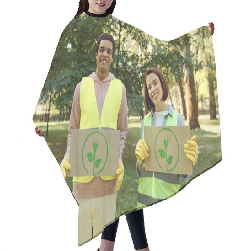 Personality  African American Man And Woman In Safety Vests Holding Up Cardboard Signs, Advocating For A Cause At A Park Cleanup Event. Hair Cutting Cape