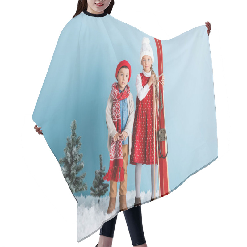 Personality  Kid Holding Ski Poles And Skis While Standing On Snow Near Brother In Winter Outfit On Blue Hair Cutting Cape