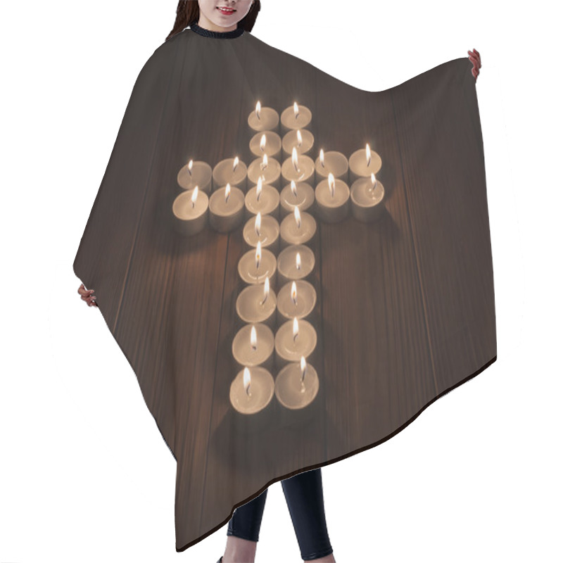 Personality  Lit Tea Lights In The Shape Of A Cross On  Wooden Surface. Hair Cutting Cape