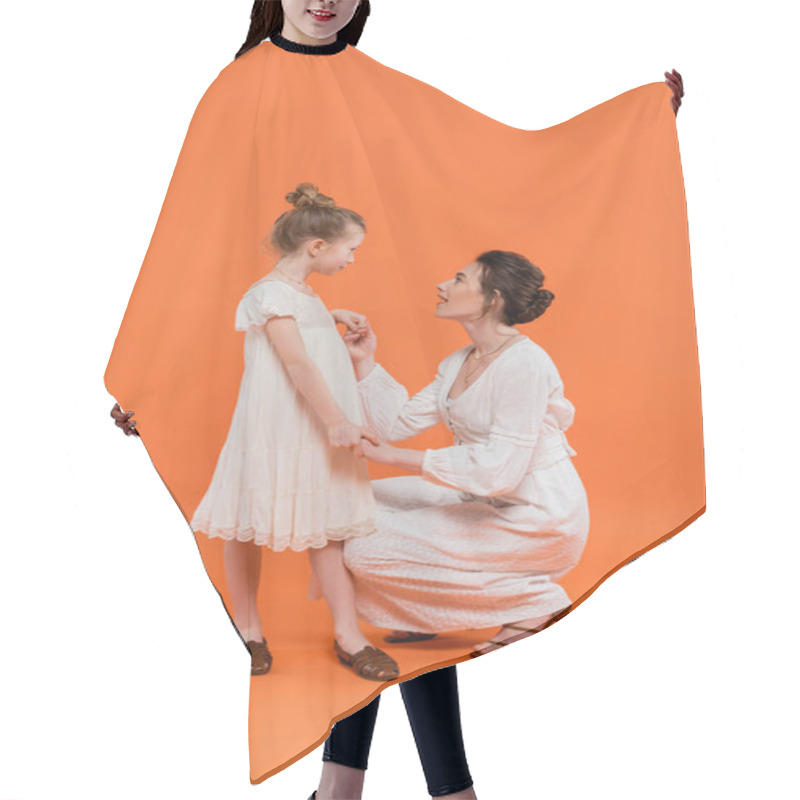 Personality  Summer Trends, Amazed Young Mother Holding Hands With Preteen Daughter On Orange Background, White Sun Dresses, Togetherness, Fashion And Style Concept, Bonding And Love  Hair Cutting Cape