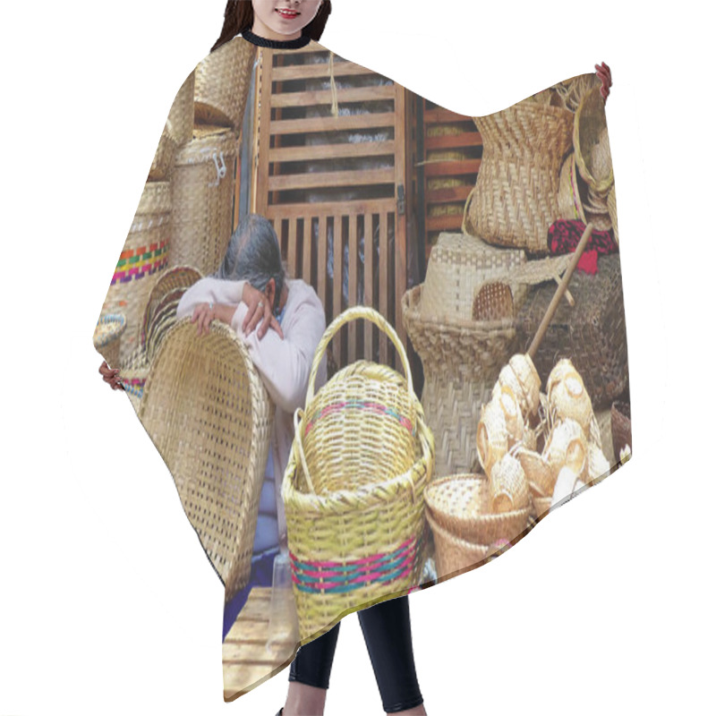 Personality  Cuenca, Ecuador - March 24, 2019: Indigenous Woman Trader Sleeping On Basket At Her Trade Place At Craft Market In Cuenca Among Woven Bags And Baskets And Other Handmade Crafts Product Hair Cutting Cape