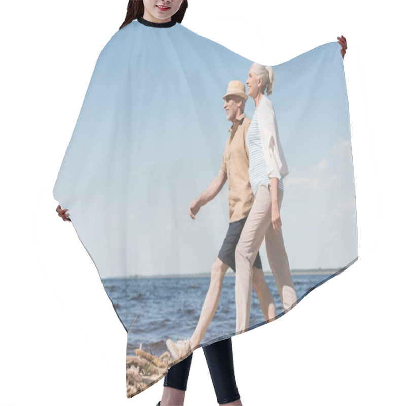 Personality  Senior Couple Walking On Beach  Hair Cutting Cape