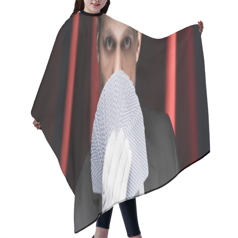 Personality  Panoramic Shot Of Magician Holding Playing Cards In Circus With Red Curtains Hair Cutting Cape