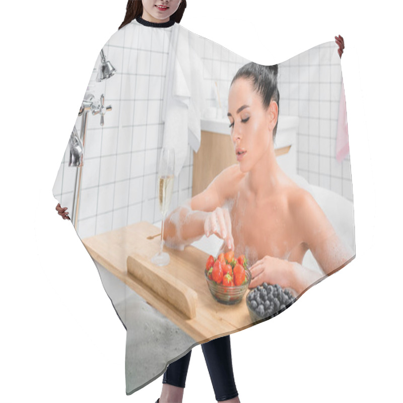 Personality  Brunette Woman Taking Strawberry Near Glass Of Champagne On Bathtub Tray  Hair Cutting Cape