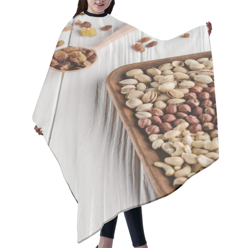 Personality  Mix Of Nuts In Plate And Raisins In Spoon On White Wooden Tabletop Hair Cutting Cape