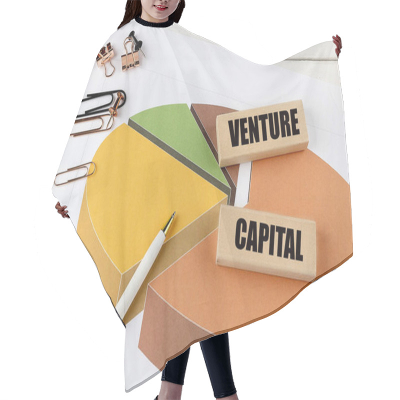 Personality  VENTURE CAPITAL Word On A Wooden Block On Chart Background .  Hair Cutting Cape