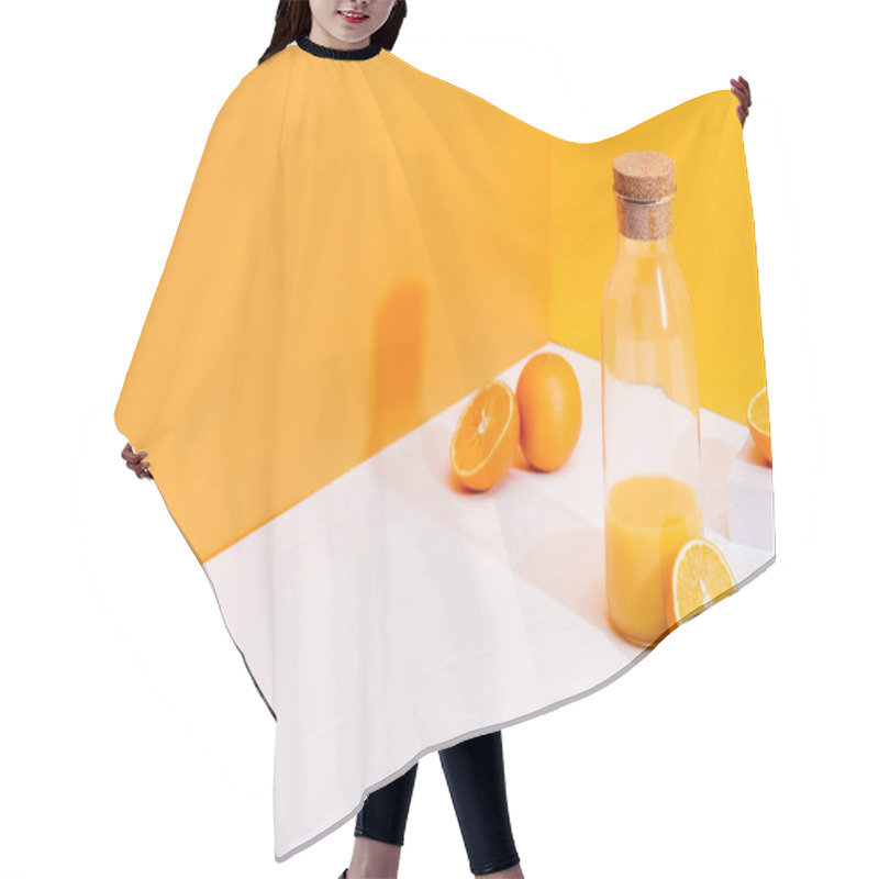 Personality  Fresh Orange Juice In Glass Bottle Near Ripe Oranges On White Surface On Orange Background Hair Cutting Cape