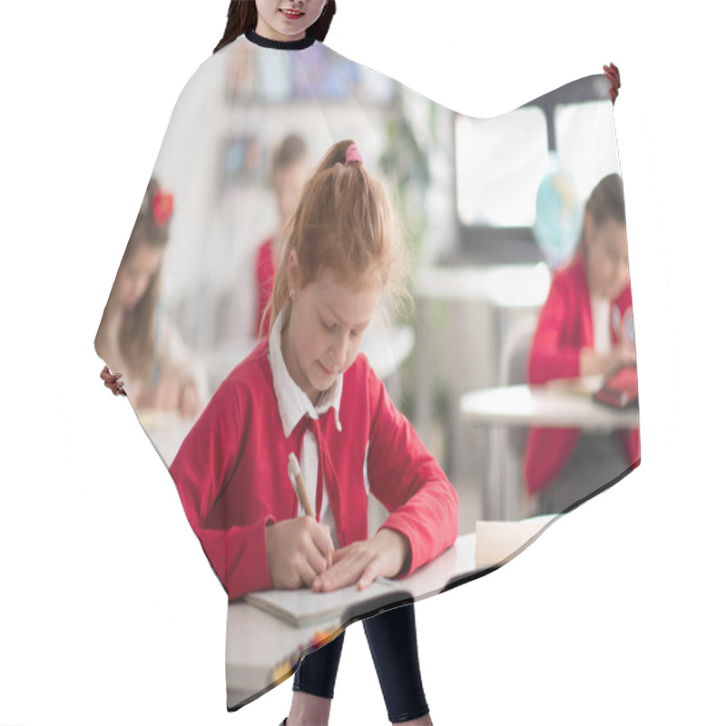 Personality  A Schoolgirl Writing Notes In Her Notebook During Lesson In Classroom At School Hair Cutting Cape