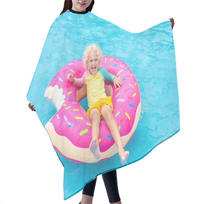 Personality  Child In Swimming Pool On Funny Inflatable Donut Float Ring. Little Boy Learning To Swim In Outdoor Pool Of Tropical Resort. Water Toys For Kids. Healthy Sport Activity For Children. Sun Protection.  Hair Cutting Cape