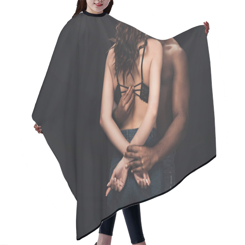 Personality  Cropped View Of African American Man Undressing Sexy Woman In Lingerie Isolated On Black With Copy Space Hair Cutting Cape