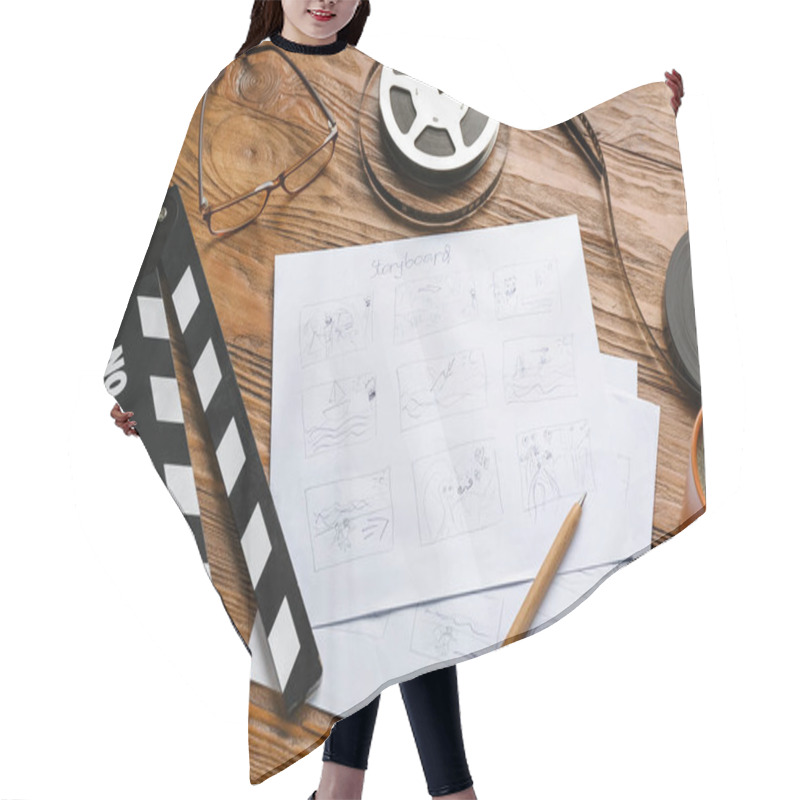 Personality  Storyboard With Movie Clapper And Film Reel On Wooden Background Hair Cutting Cape