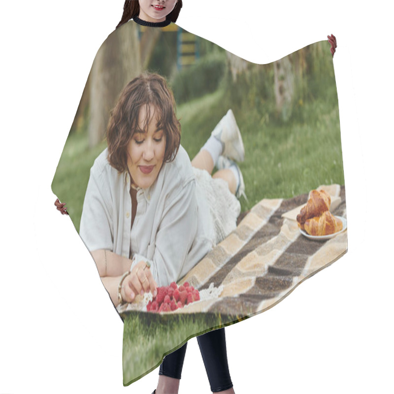 Personality  A Young Woman In A White Shirt Relaxes On A Blanket, Savoring Delicious Berries During A Sunny Picnic. Hair Cutting Cape