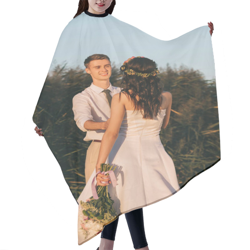 Personality  Happy Young Wedding Couple Holding Hands And Looking At Each Other In Park Hair Cutting Cape