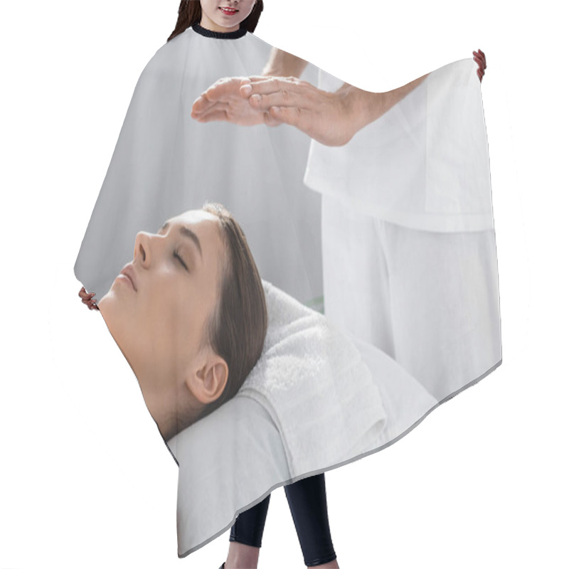 Personality  Cropped View Of Healer Standing Near Patient On Massage Table And Cleaning Aura Hair Cutting Cape