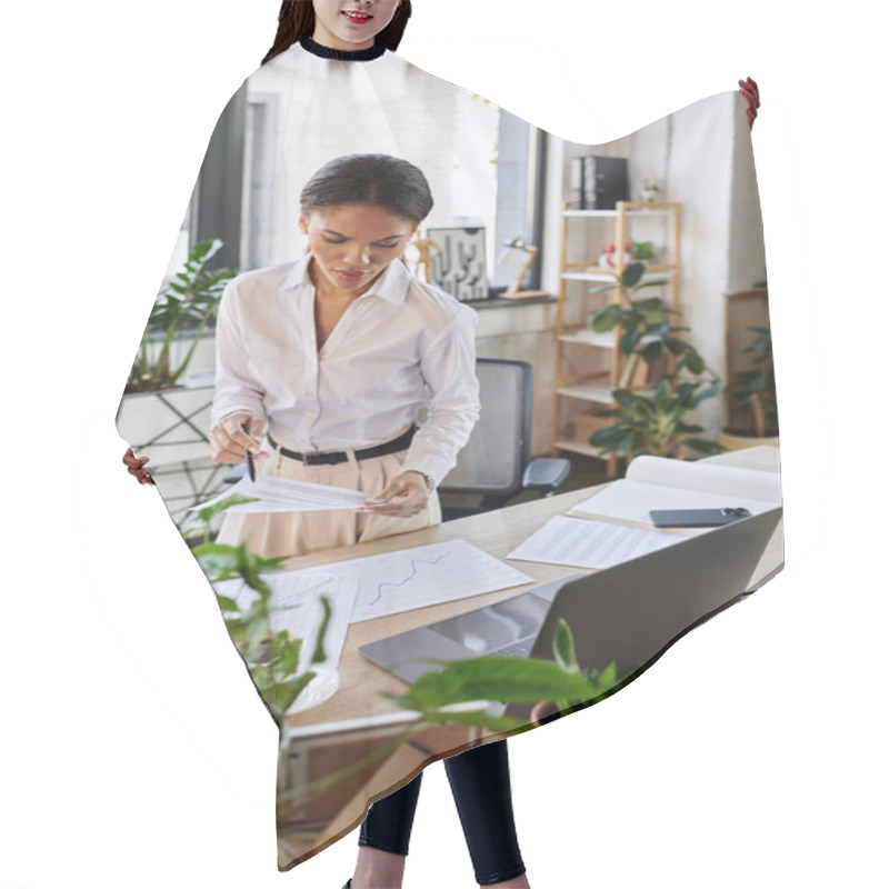 Personality  A Young Black Businesswoman Reviews Reports In Her Stylish, Plant-filled Office. Hair Cutting Cape