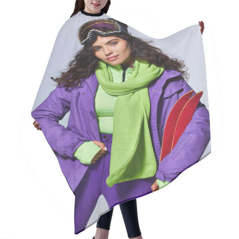 Personality  Winter Sport, Attractive Woman With Curly Hair Posing In Active Wear With Puffer Jacket And Skis Hair Cutting Cape