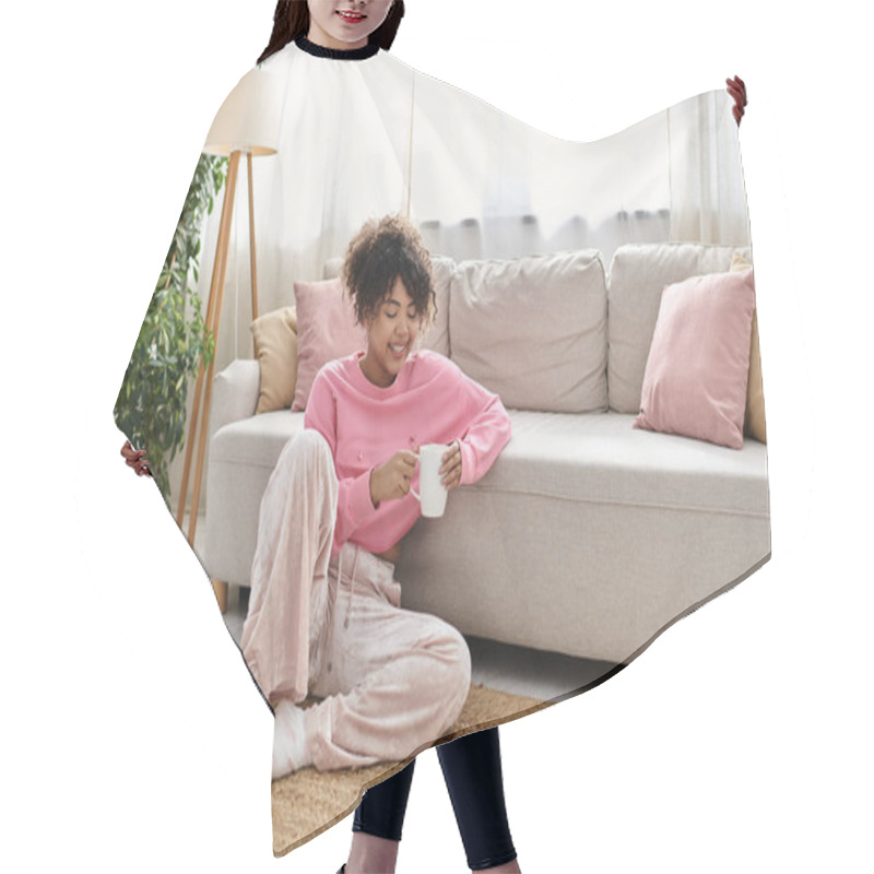 Personality  A Young Woman Enjoys A Warm Drink While Relaxing On A Plush Sofa. Hair Cutting Cape