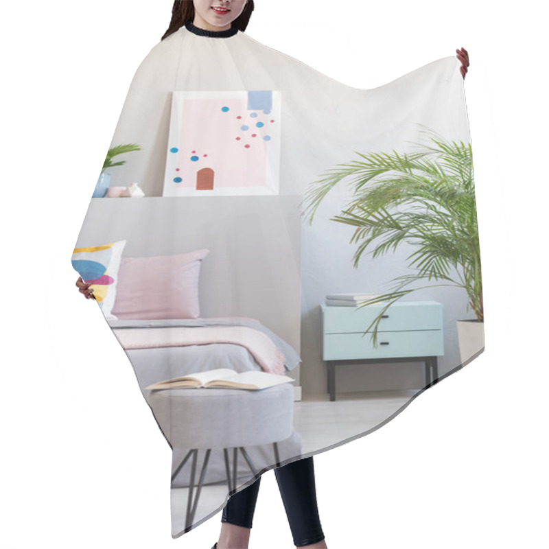 Personality  Abstract Poster In Real Photo Of Bright Bedroom Interior With Open Book On Hairpin Pouf, Fresh Plants And Bedside Table Hair Cutting Cape