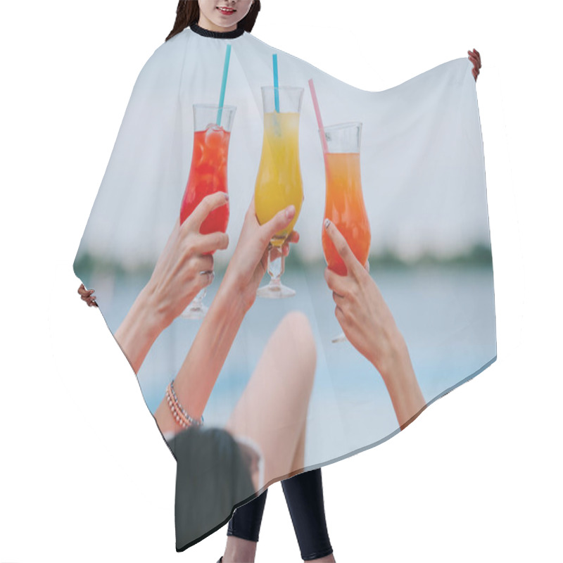 Personality  Cropped Shot Of Young Female Friends Holding Glasses With Summer Cocktails At Beach Hair Cutting Cape