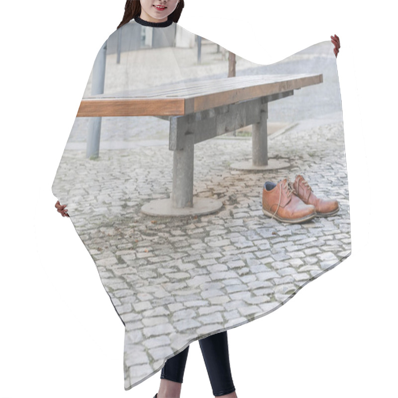 Personality  Brown Leather Shoes On A Cobblestone Pavement Next To A Bench In An Urban Setting. Hair Cutting Cape