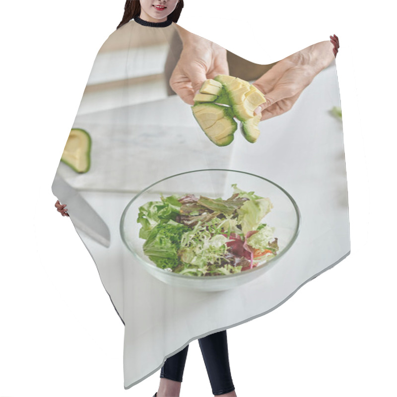 Personality  Close Up Of Cropped Woman Holding Sliced Ripe Avocado Near Lettuce In Bowl And Glass Of Red Wine Hair Cutting Cape