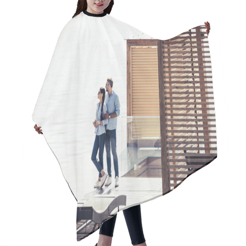 Personality  Stylish Couple Standing On Pier Near Lake At Country House  Hair Cutting Cape