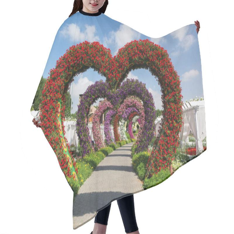 Personality  DUBAI, UNITED ARAB EMIRATES - DECEMBER 8, 2016: Dubai Miracle Garden Is The Biggest Natural Flower Garden In The World. Hair Cutting Cape