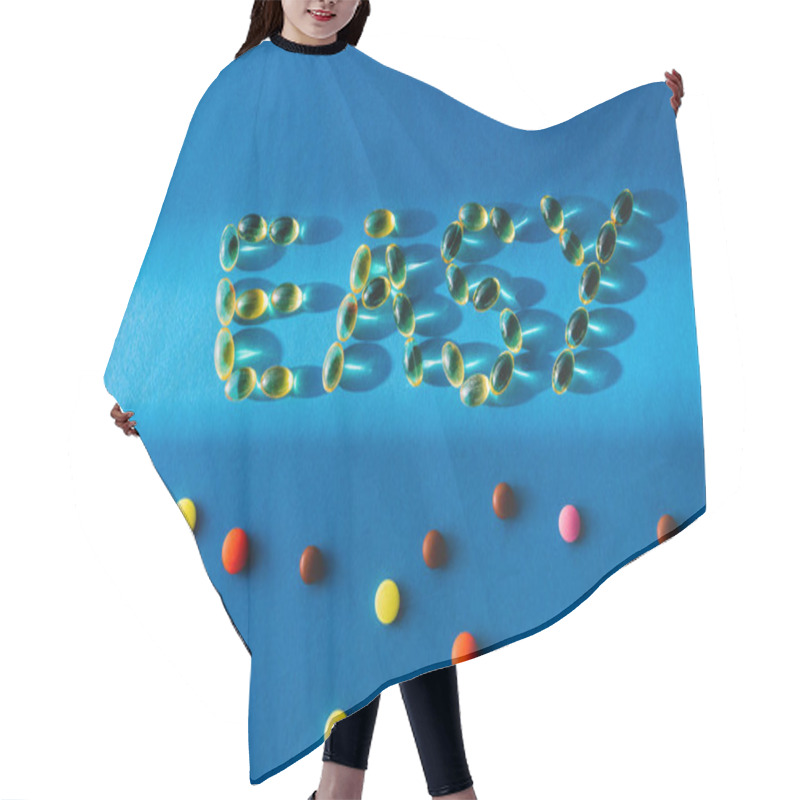 Personality  Top View Of Lettering Easy By Pills Near Various Tablets On Blue Background With Sunlight  Hair Cutting Cape