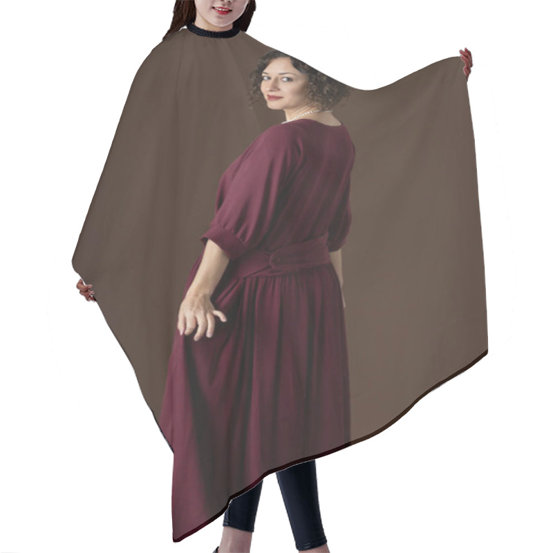 Personality  A 1920s Woman Wearing A Dark Red Day Dress And Standing Against A Studio Backdrop Hair Cutting Cape