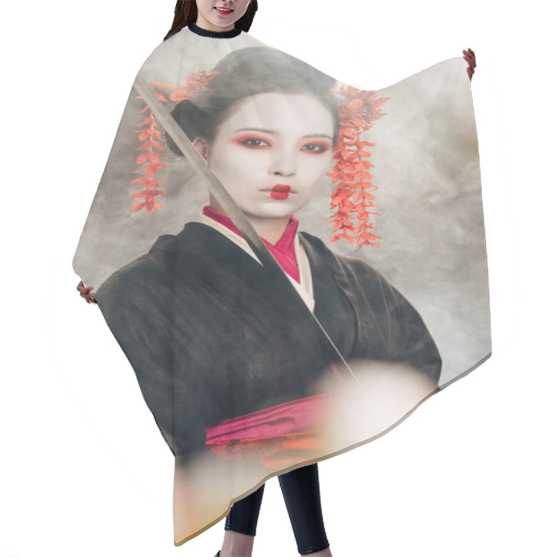 Personality  Selective Focus Of Beautiful Geisha In Black Kimono Holding Katana In Smoke And Sakura Branches Hair Cutting Cape