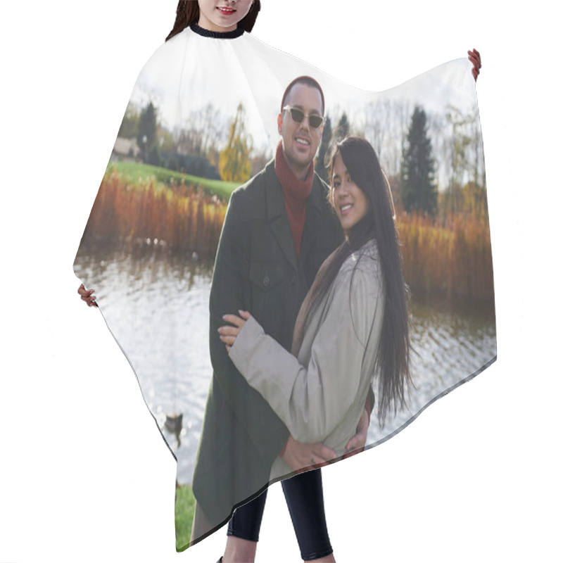 Personality  A Couple In Stylish Autumn Attire Joyfully Poses Together By A Peaceful Lake, Enjoying The Moment. Hair Cutting Cape