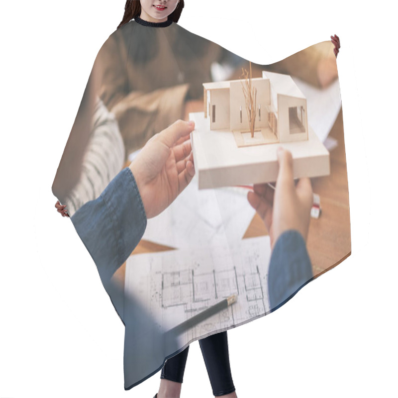 Personality  Group Of An Architect Holding And Discussing About An Architecture Model With Shop Drawing Paper On Table In Office Hair Cutting Cape