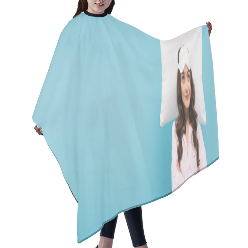 Personality  Smiling Young Woman In Pajamas And Night Mask Standing With Crossed Arms Near White Flying Pillow Isolated On Blue, Banner  Hair Cutting Cape