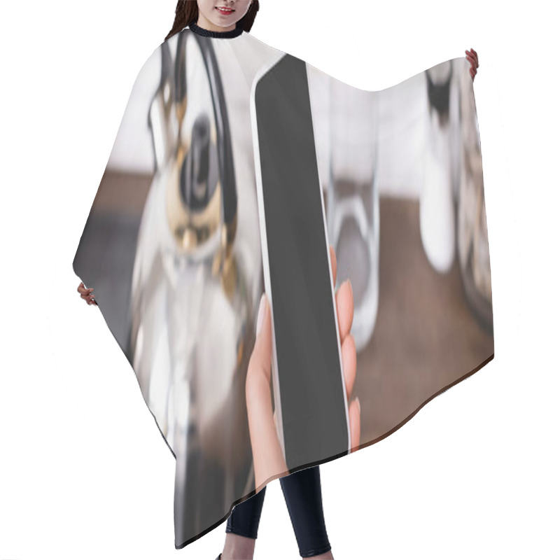 Personality  Panoramic Shot Of Woman Holding Smartphone With Blank Screen Near Kettle On Stove  Hair Cutting Cape