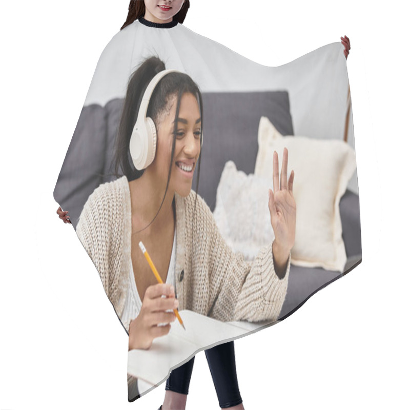 Personality  A Young Woman Engages In Remote Learning From Her Cozy Home Setting, Smiling And Focused. Hair Cutting Cape