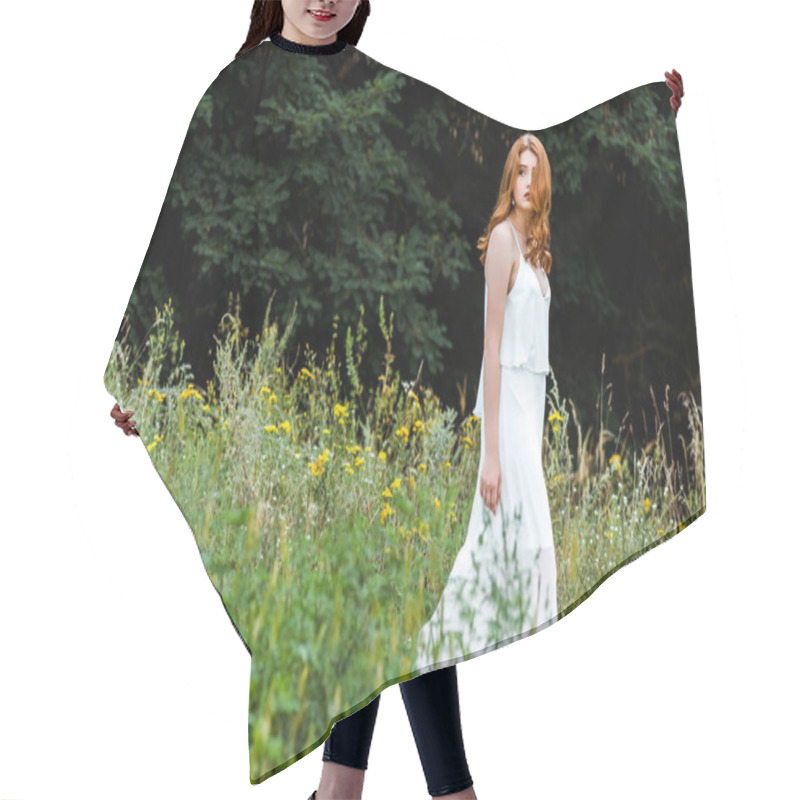 Personality  Selective Focus Of Beautiful Redhead Girl In White Dress Walking In Field With Wildflowers  Hair Cutting Cape