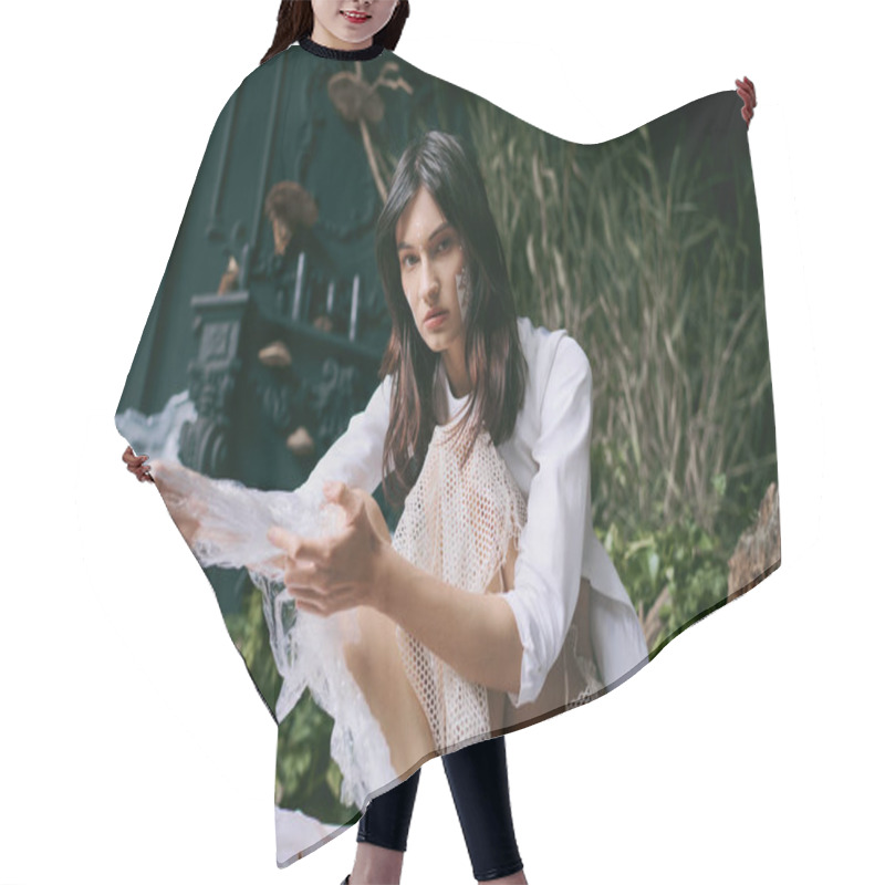 Personality  A Woman In A White Dress Poses Amidst A Swamp Filled With Plastic Waste. Hair Cutting Cape