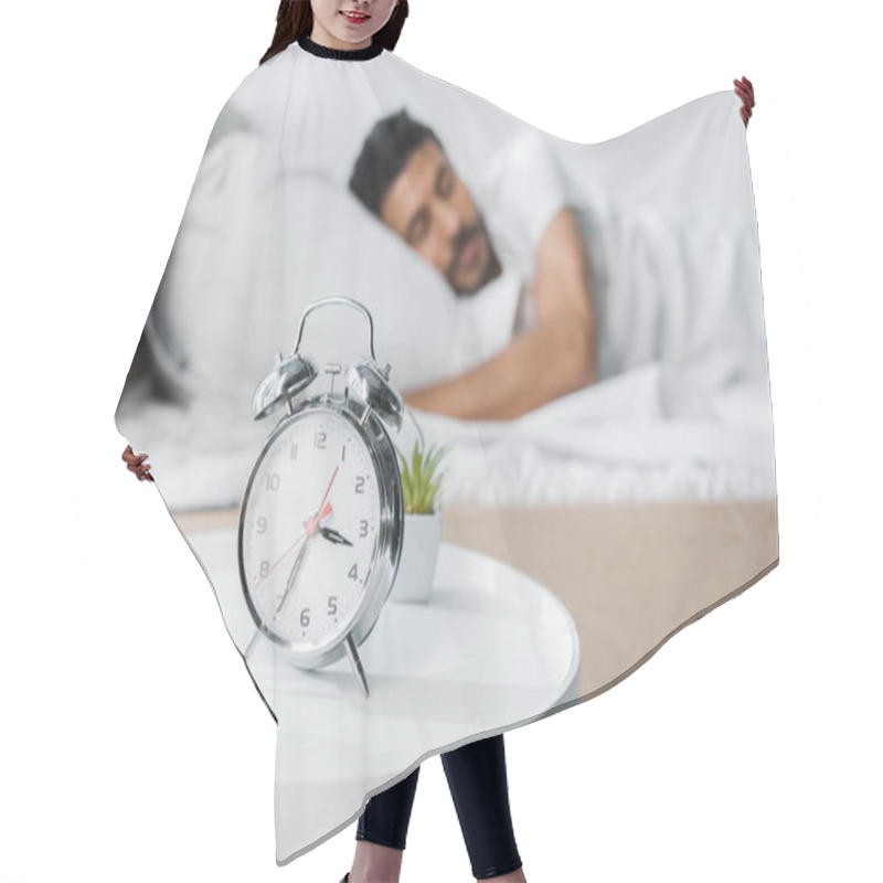 Personality  Selective Focus Of Alarm Clock, Plants And Handsome Bi-racial Man Sleeping On Background  Hair Cutting Cape