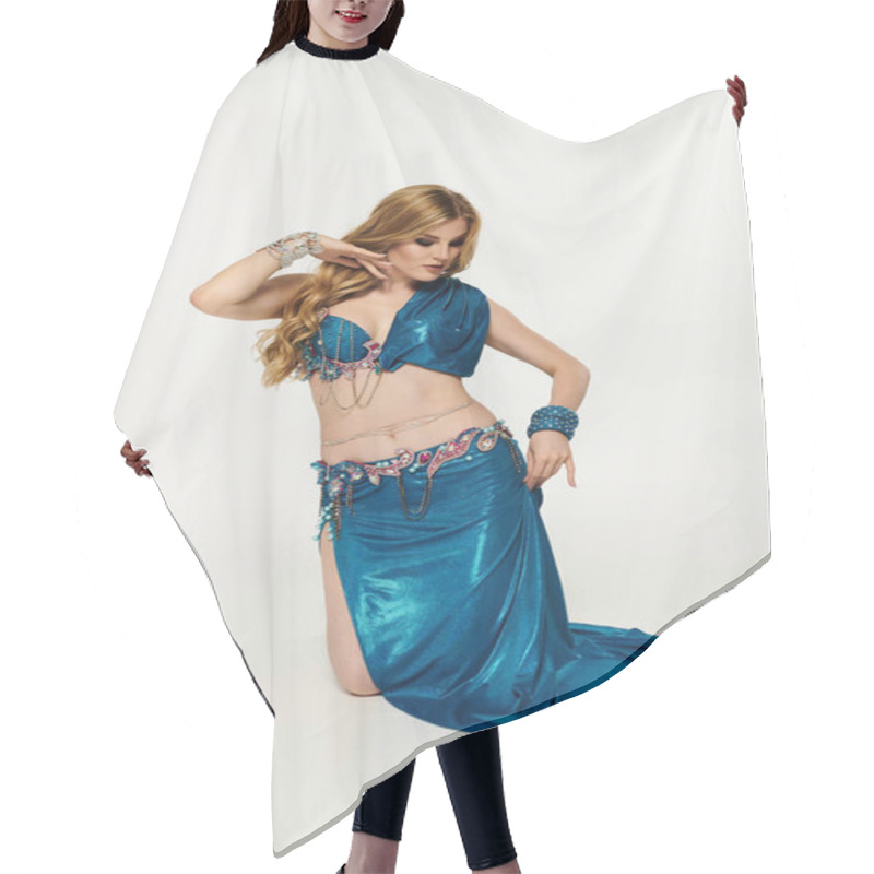 Personality  Young Woman Mesmerizes In Flowing Blue Belly Dance Outfit. Hair Cutting Cape